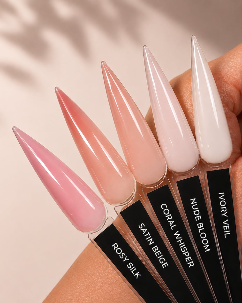 Five Liquid Polygel shades swatched on natural nail tips